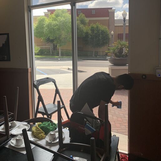Man wrapping a window